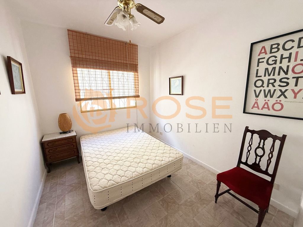 Bright bedroom with practical layout and high-quality ceiling lighting