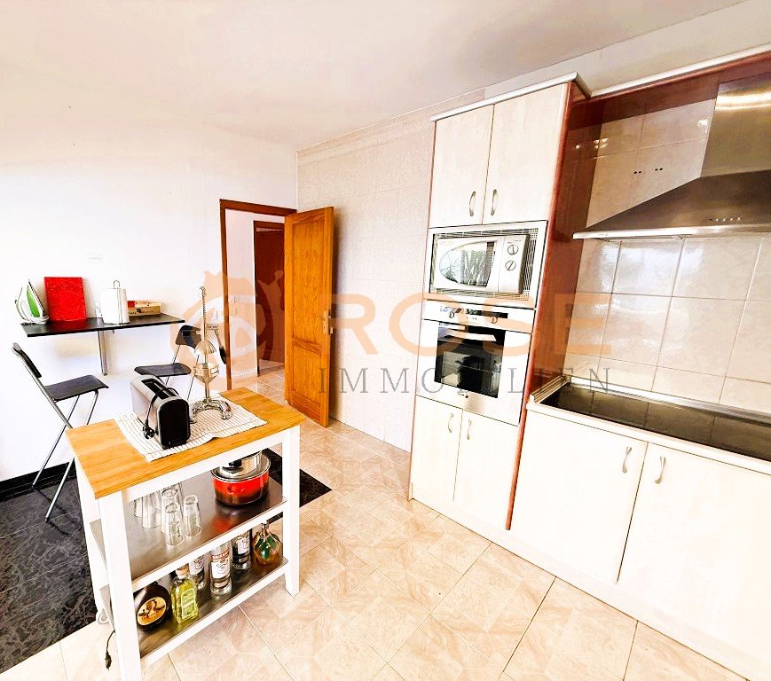 Functional kitchen with modern cooking area and practical workspace