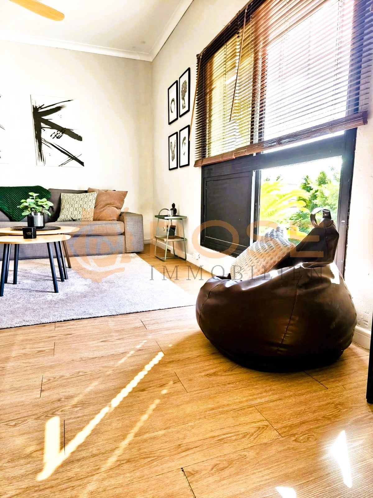 Bright living area with direct terrace access and high-quality flooring