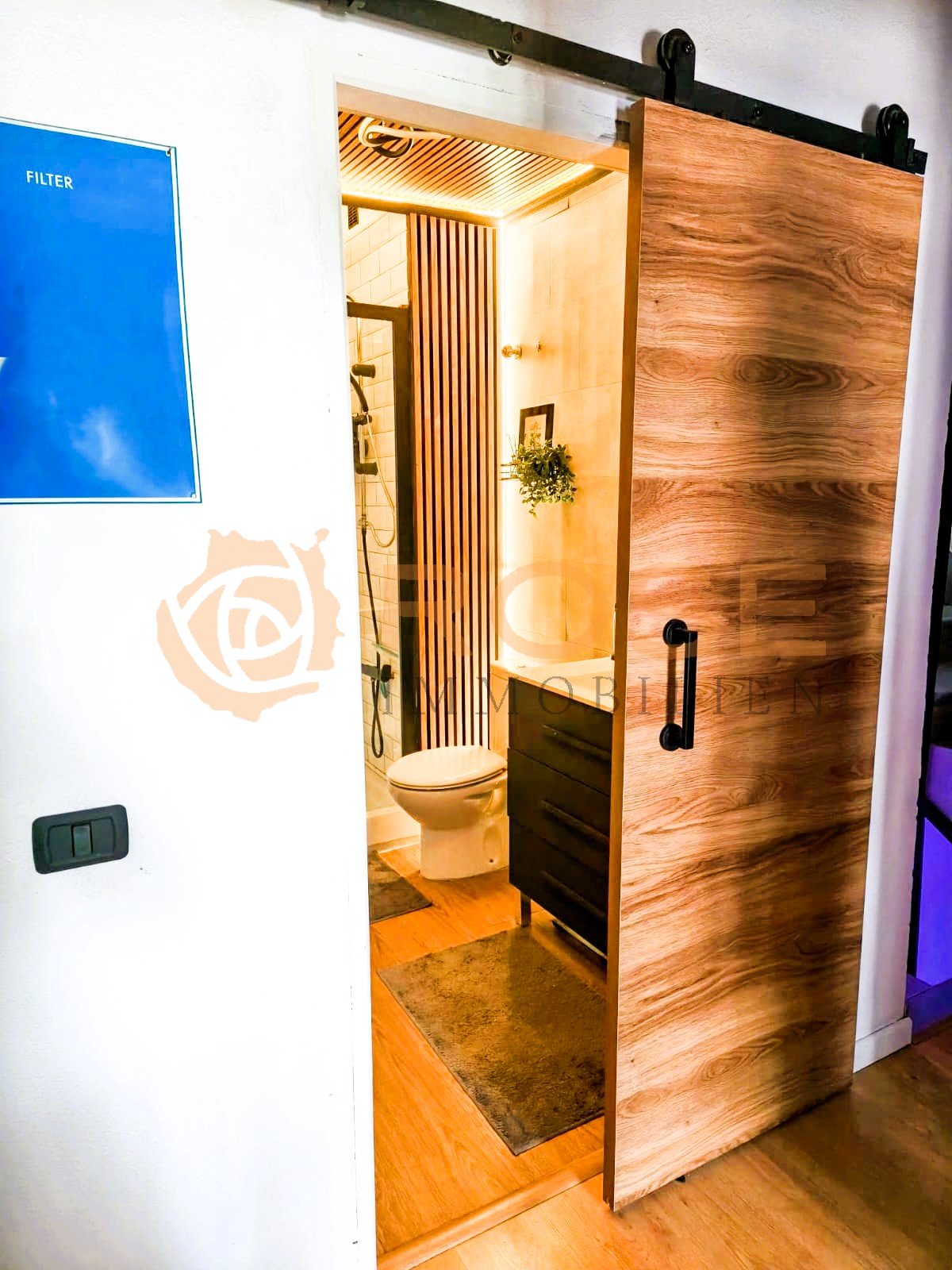 Modern guest bathroom with elegant sliding door solution and high-quality sanitary fittings