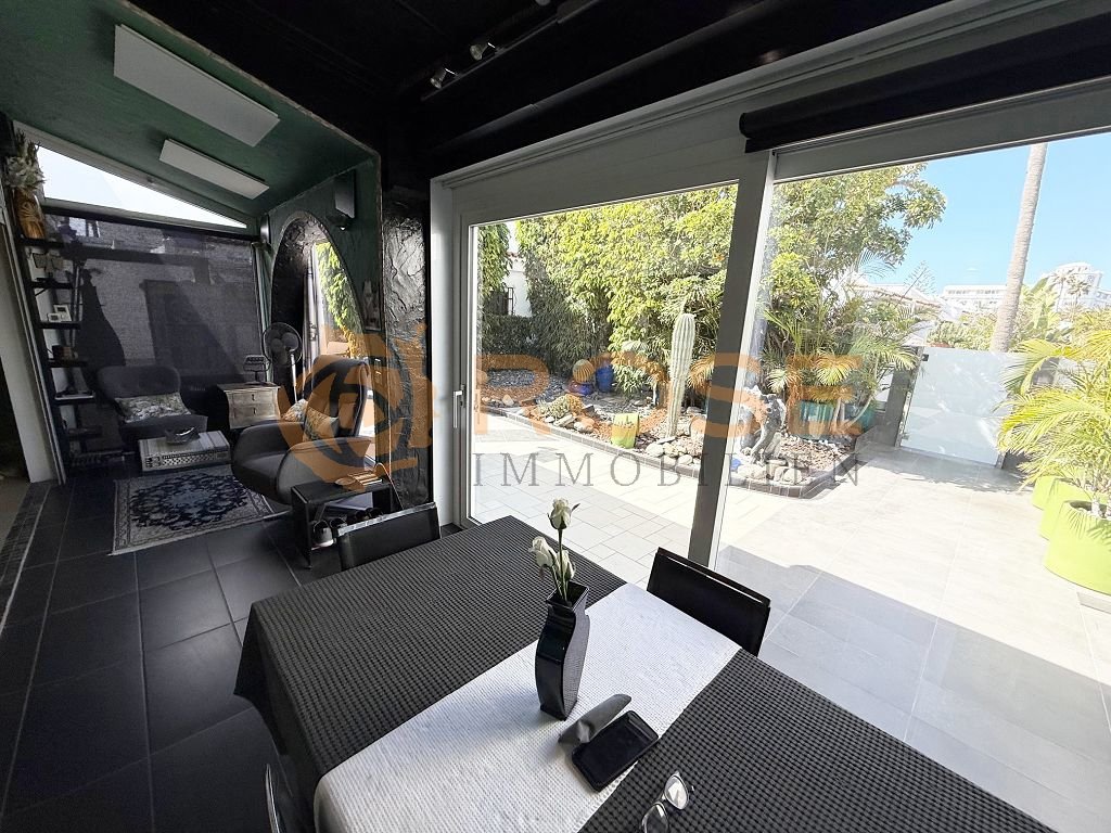 Living area with large sliding glass doors and direct terrace access