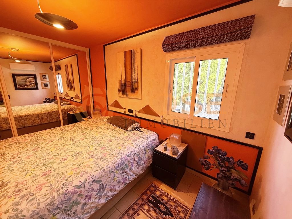 Main bedroom with mirrored sliding wardrobe and direct terrace access