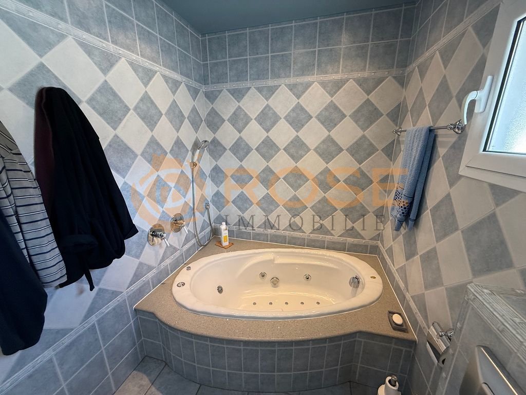 Luxurious bathroom with whirlpool tub and high-quality tile design