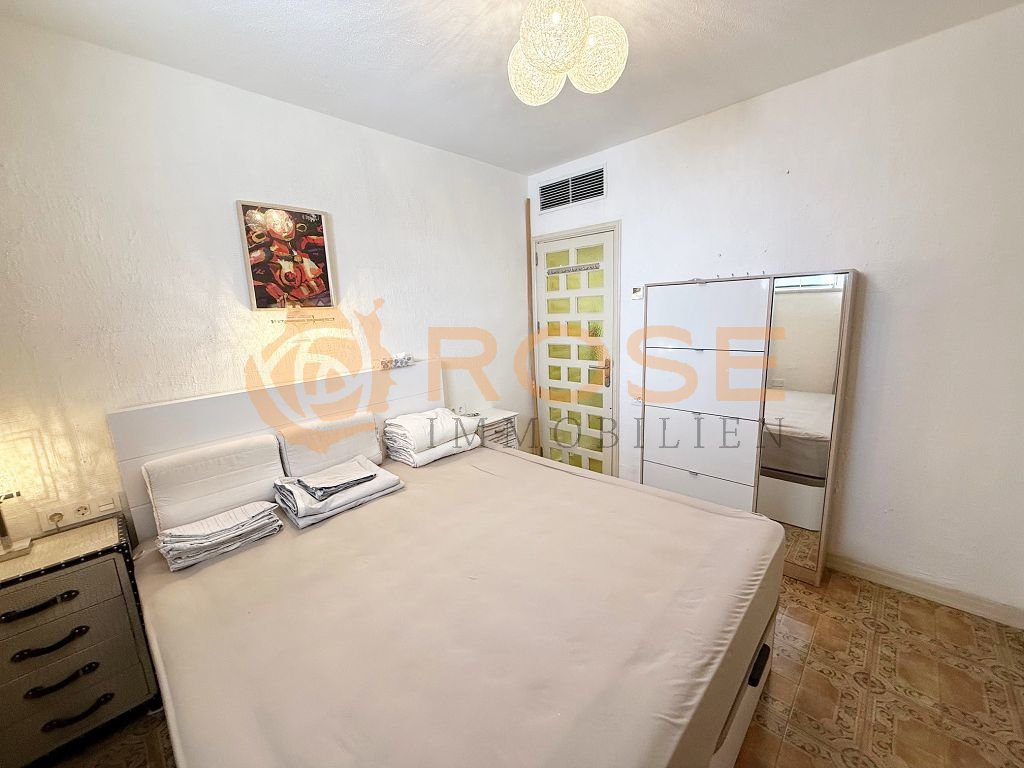 Spacious bedroom with practical built-in wardrobes and air conditioning