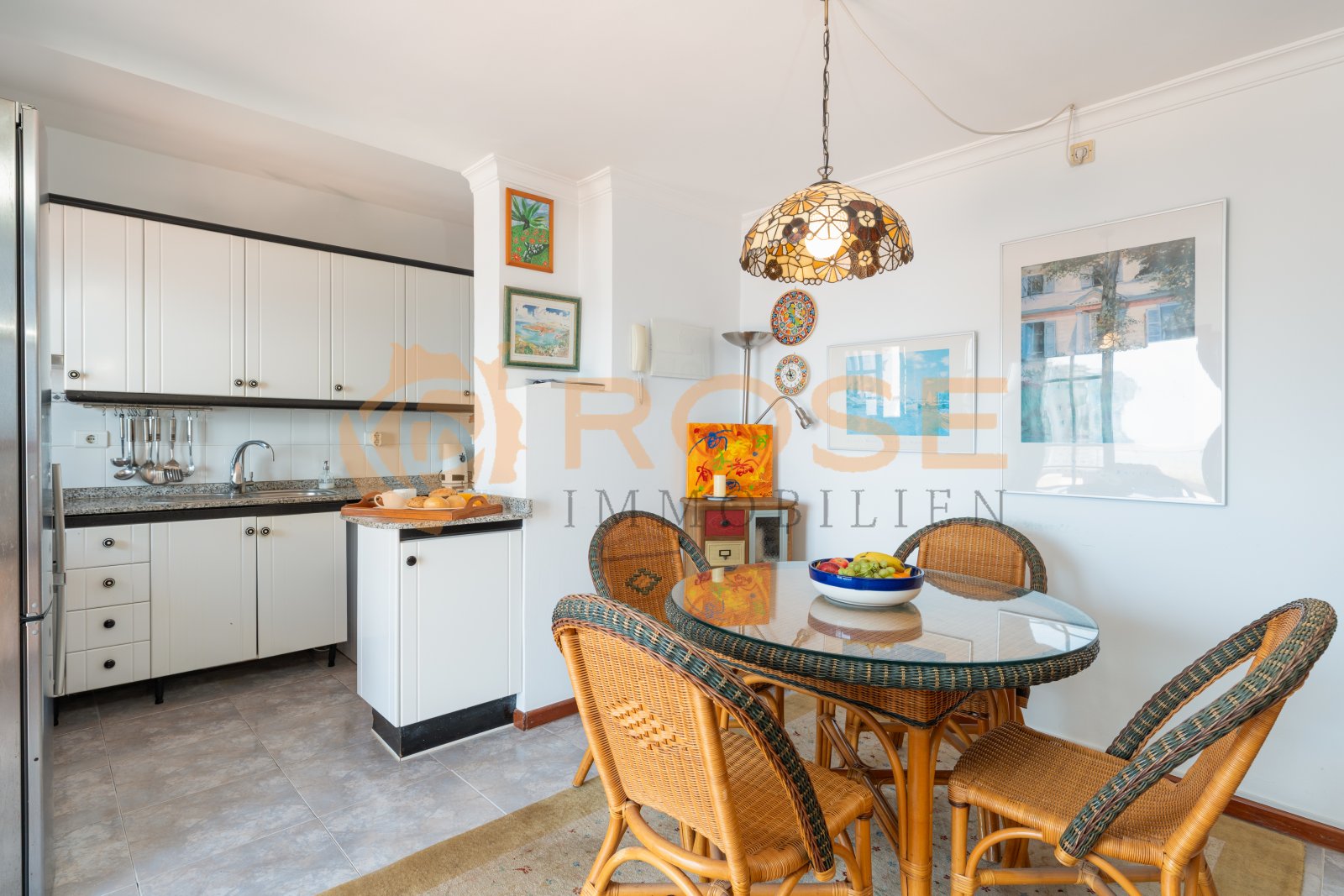 Open kitchen-living area with functional layout and large window openings