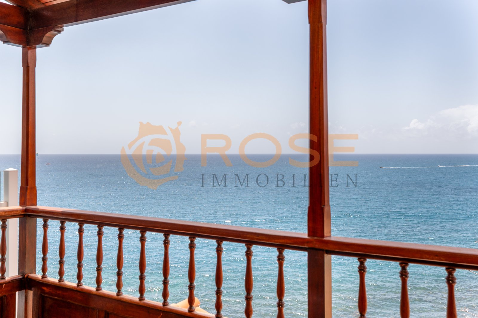 Veranda with panoramic sea view and protective wooden architecture