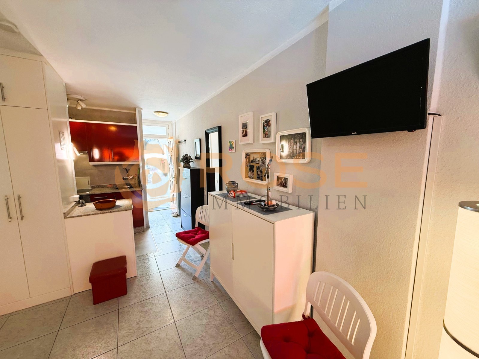 Kitchen-living area with smart space utilization and open design