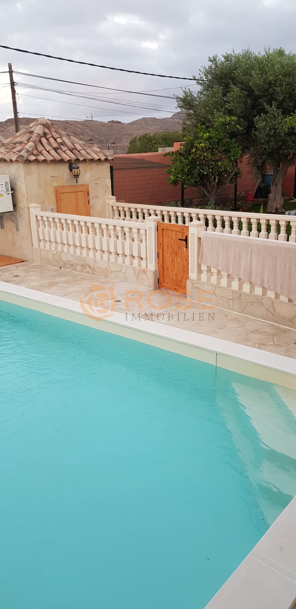 Pool house with direct water access and shaded veranda