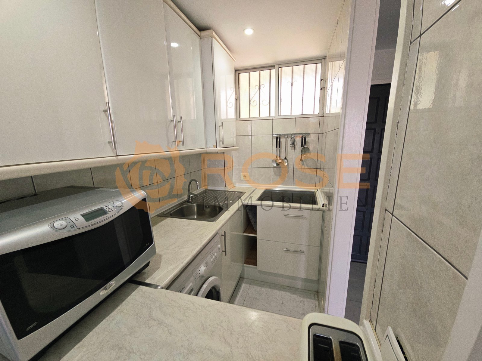 Compact kitchen with efficient workspace and practical storage Compact kitchen with efficient workspace and practical storage