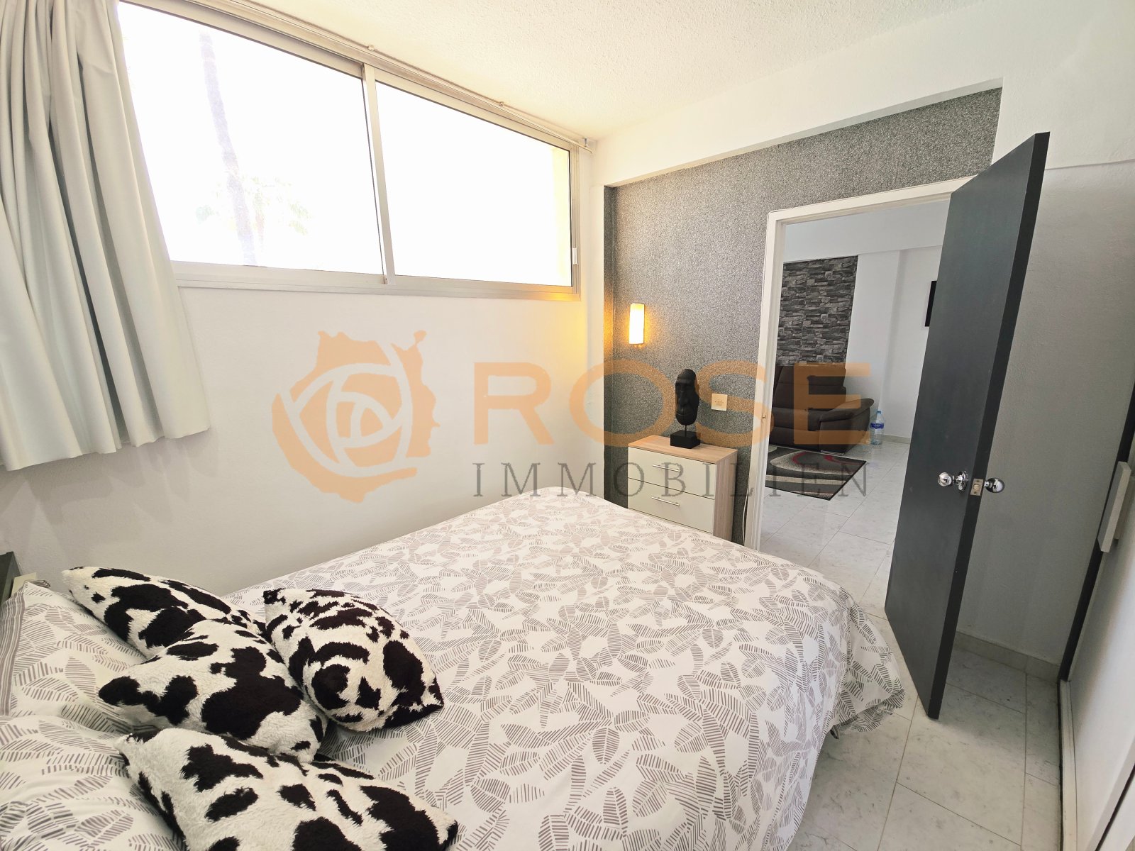 Bedroom with direct access to the walk-in closet and large window front Bedroom with direct access to the walk-in closet and large window front