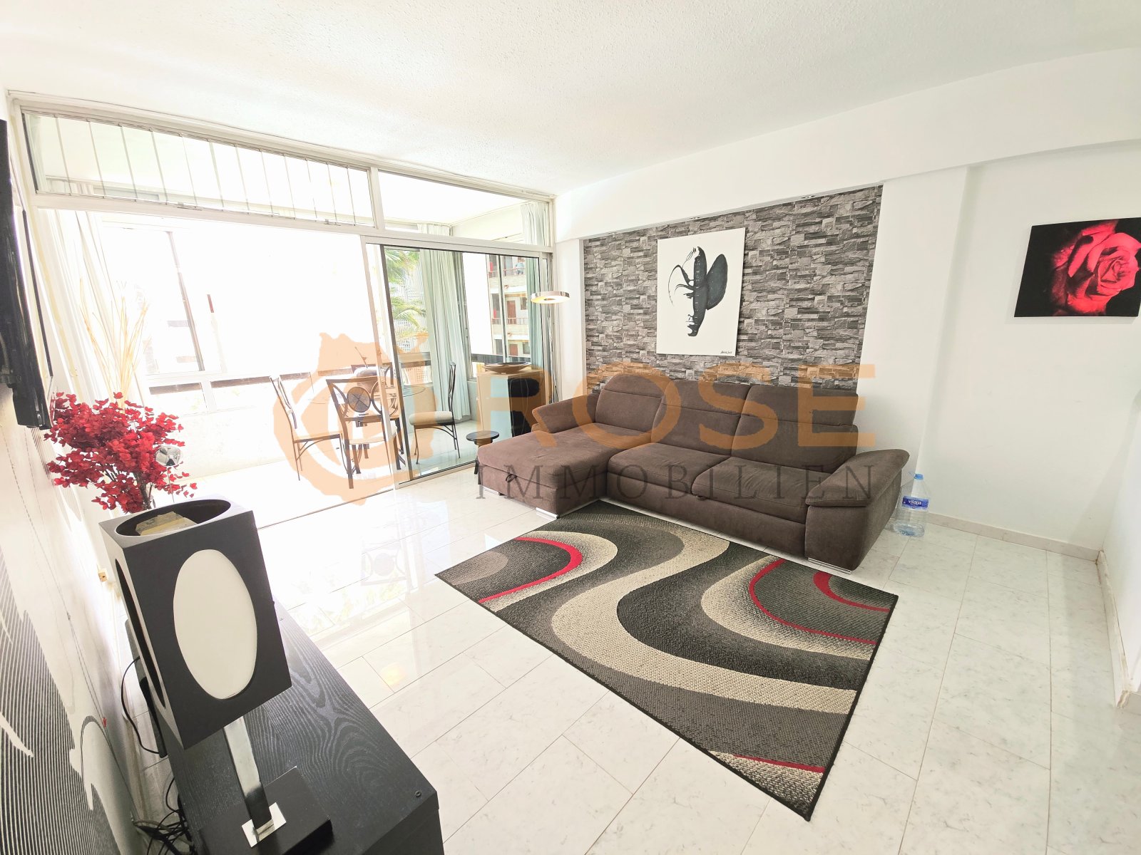 Bright living room with floor-to-ceiling window and direct terrace access Bright living room with floor-to-ceiling window and direct terrace access