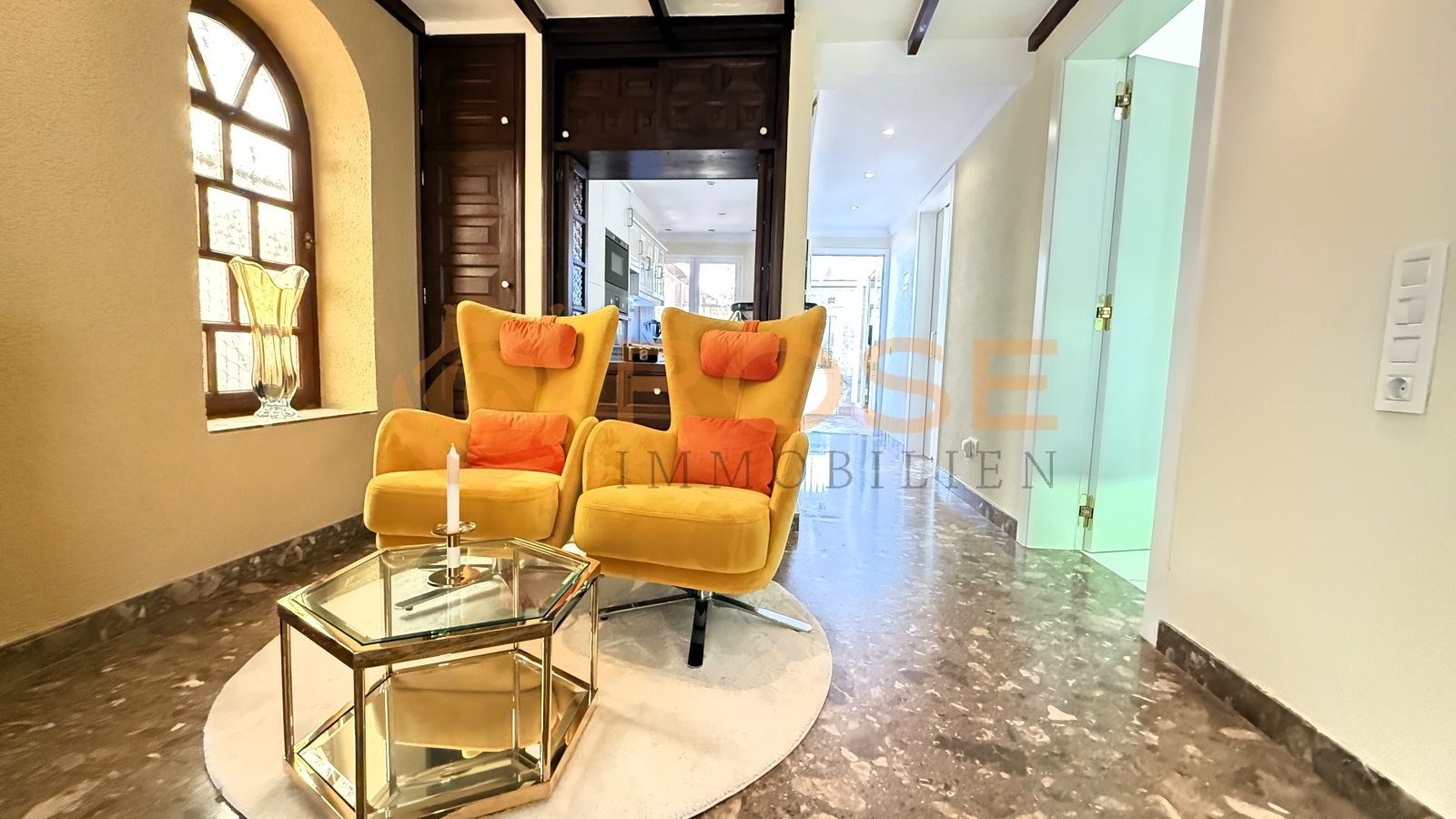 Elegant entrance area with arcade window and direct access to all living spaces
