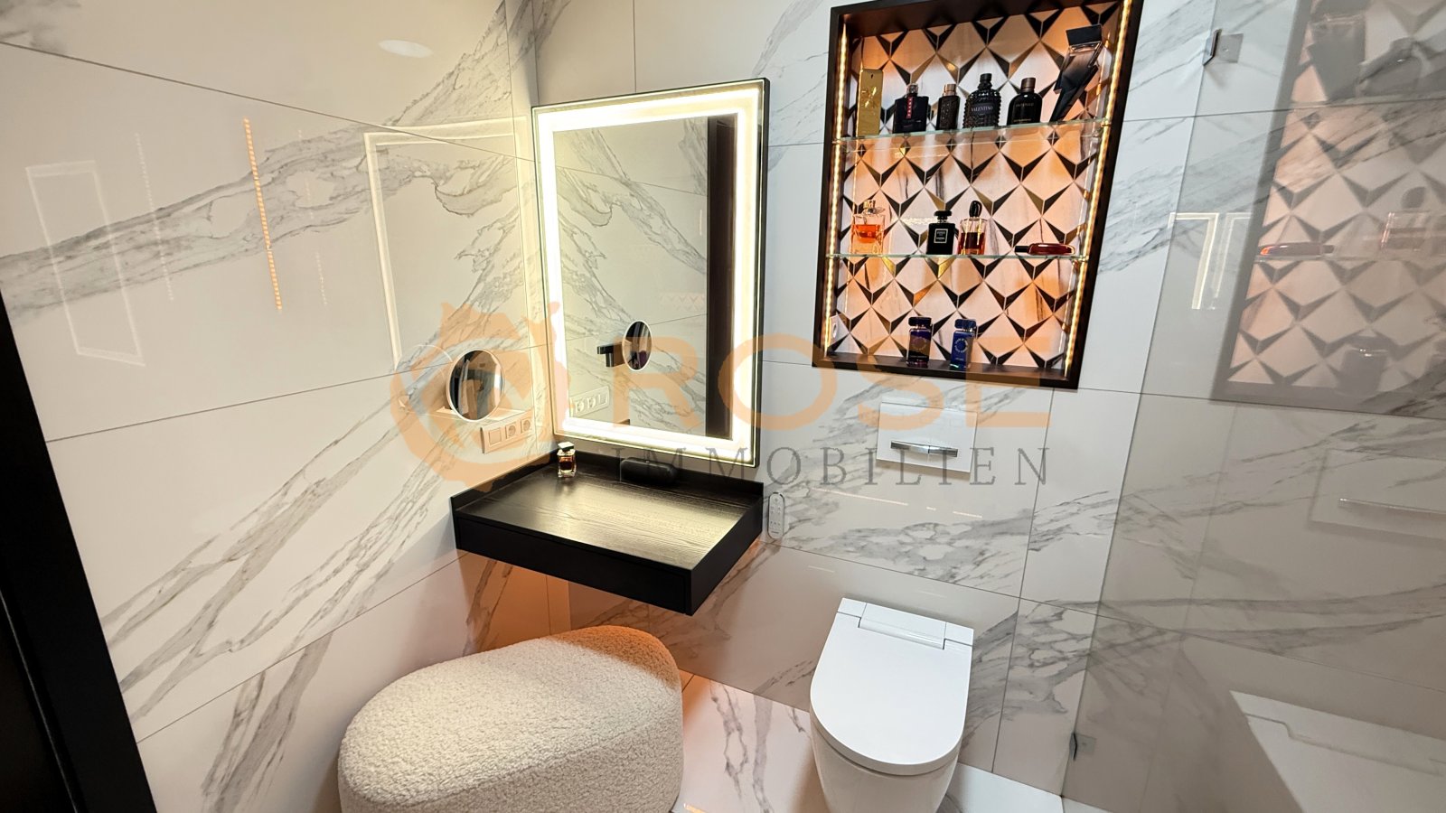 Modern bathroom with LED mirror element and illuminated wall niche – spa atmosphere in a private setting