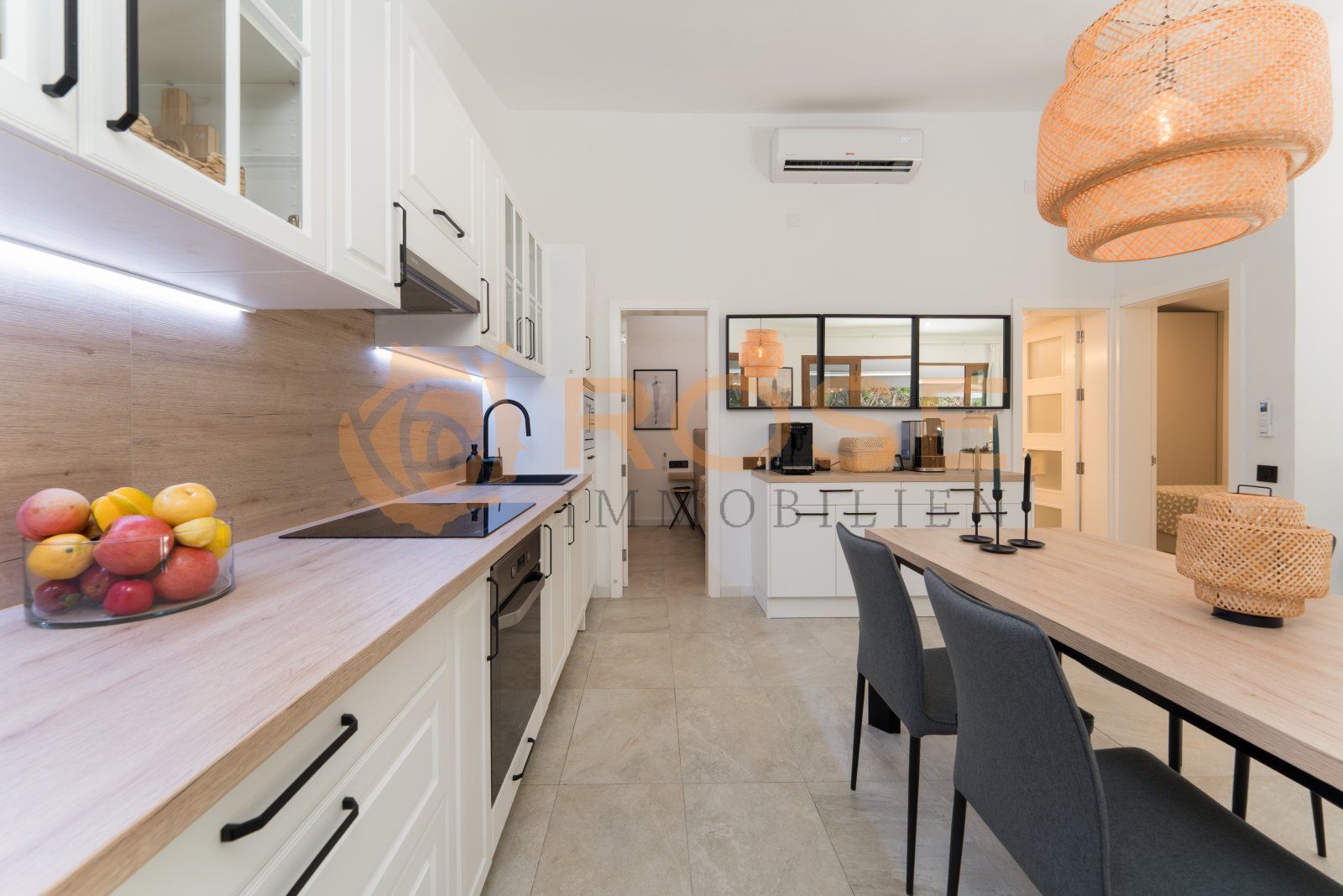 Modern open-plan kitchen with integrated dining area Modern open-plan kitchen with integrated dining area