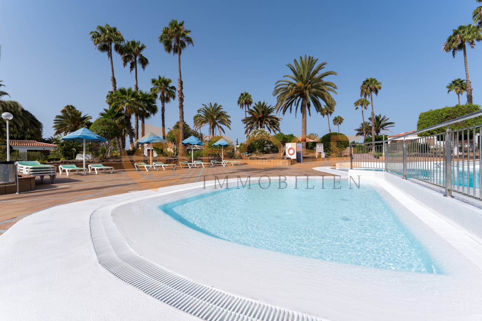 Community pool with ergonomic edge and professional safety equipment Community pool with ergonomic edge and professional safety equipment