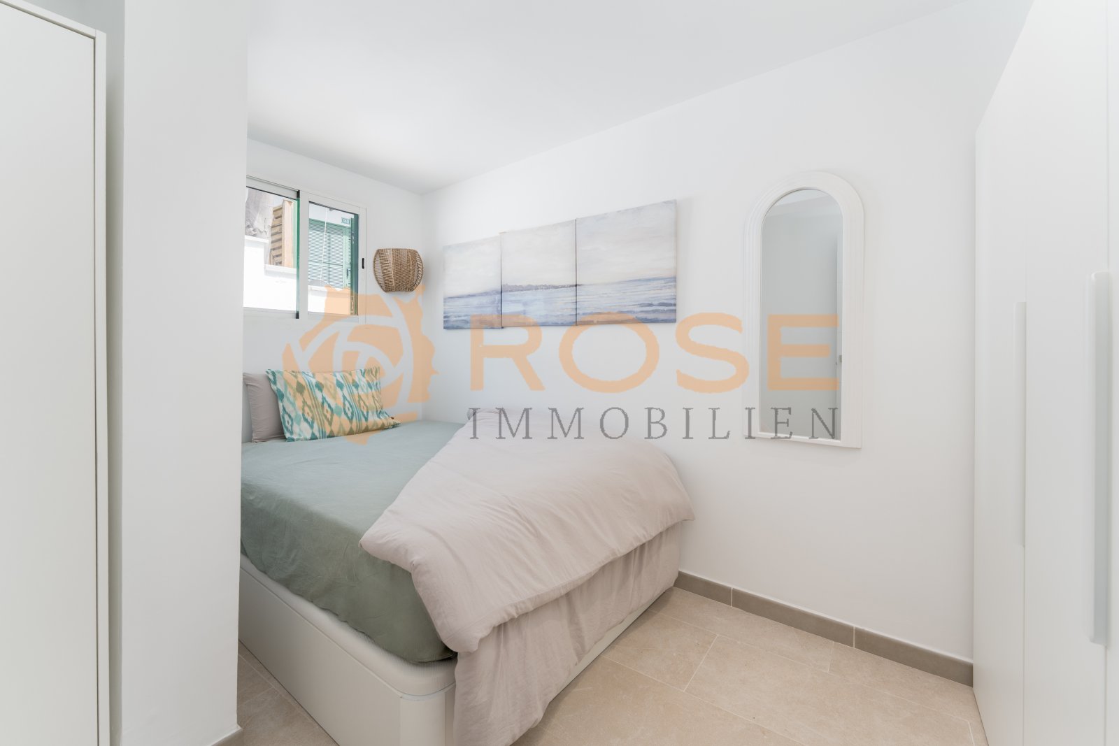 Compact bedroom with smart space utilization and a window front to the outdoor area Compact bedroom with smart space utilization and a window front to the outdoor area