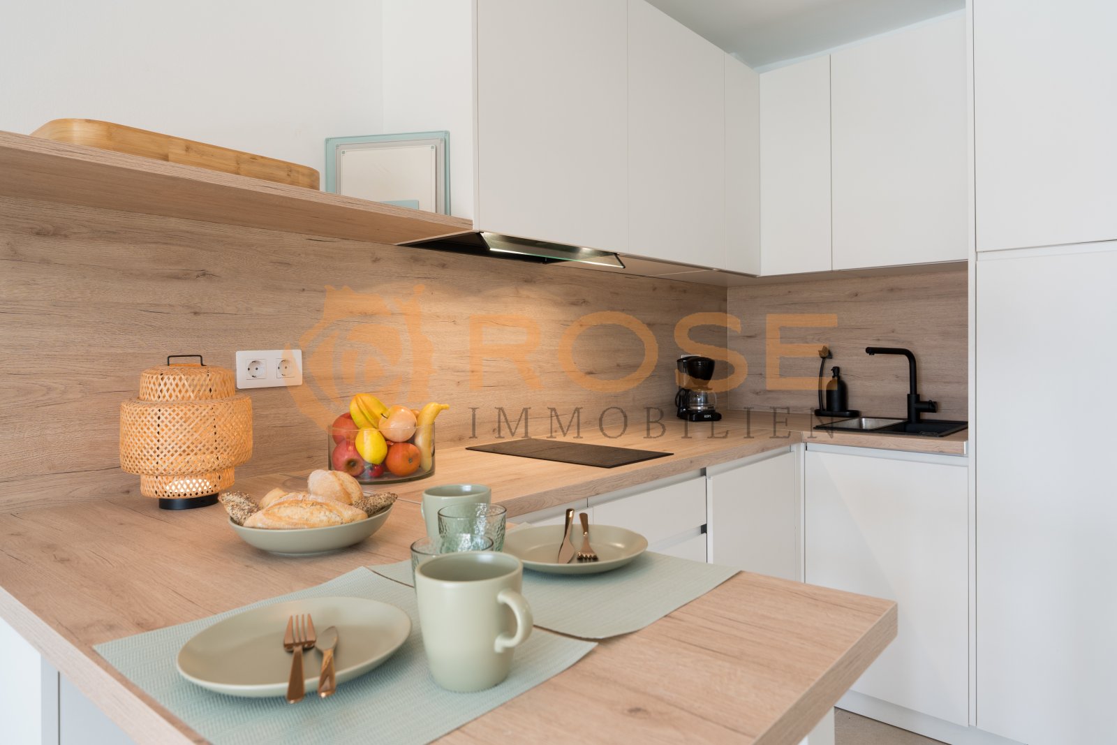 Modern kitchen unit with integrated cooktop, practical work counter, and intelligent storage design Modern kitchen unit with integrated cooktop, practical work counter, and intelligent storage design