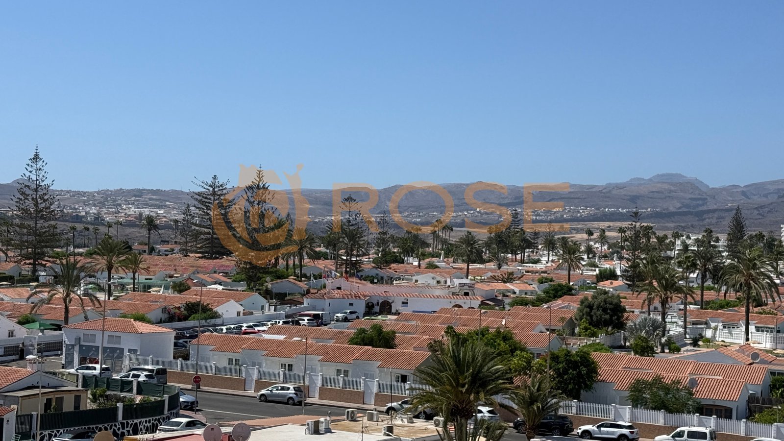 View of the coastal landscape with mountain panorama and palm gardens