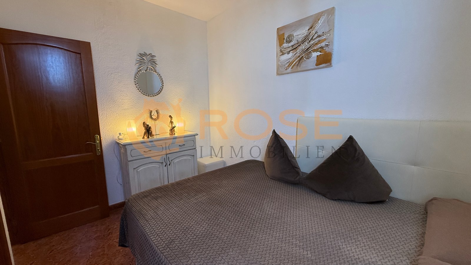 Bedroom with practical layout and direct terrace access