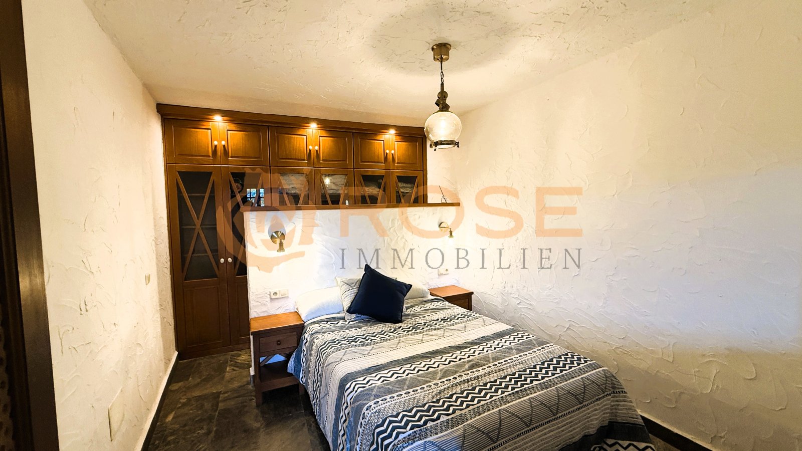 Comfortable bedroom with built-in wardrobe and high-quality furnishings